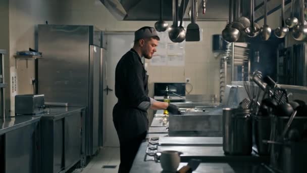 Professional Kitchen Hotel Restaurant Chef Flips Burger Patty Spatula Air — Stock Video
