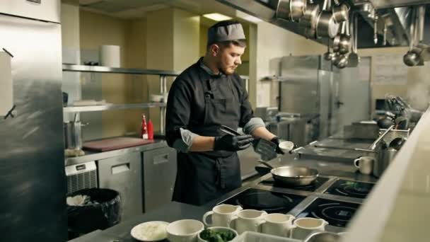 Professional Kitchen Hotel Restaurant Chef Prepares Risotto Dish Adds Ingredients — Stock Video