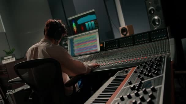 Energetic Audio Engineer Producer Working Recording Studio Mixing Track Console — Stock Video