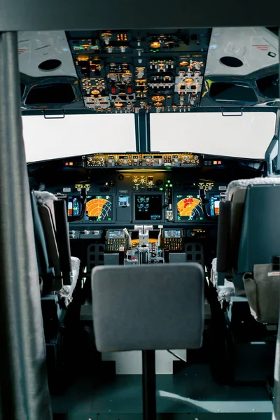 Empty airplane cockpit or flight deck modern passenger plane ready fly flight simulator
