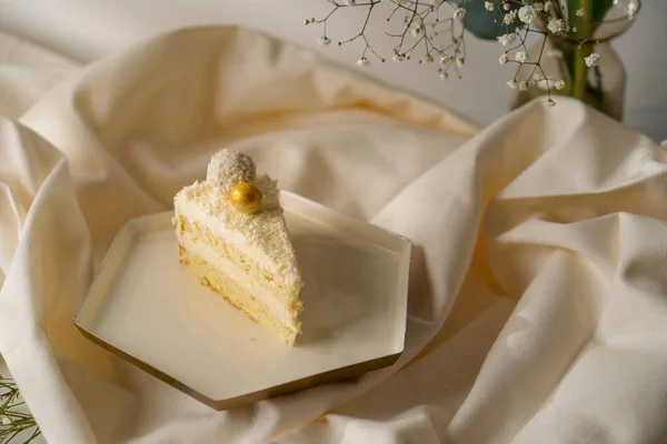 Piece Delicious Fresh Cream Sponge Cake Decorated Coconut Candies Beige — Stock Photo, Image