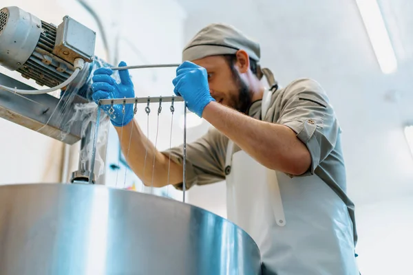 Worker Mixing Small Pieces Soft Cheese Vat Big Iron Plate — Stock Photo, Image