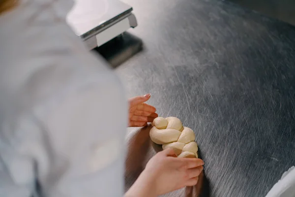 Baker Forms Braid Raw Dough Kitchen Professional Kitchen Bakery Production — Stock Photo, Image