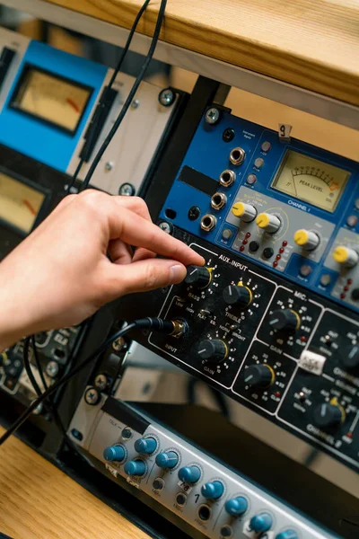 Sound engineer using digital audio mixer sliders Engineer pressing keys add control panel volume Recording studio technician close up