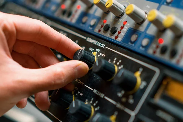 Sound engineer using digital audio mixer sliders Engineer pressing keys add control panel volume Recording studio technician close up