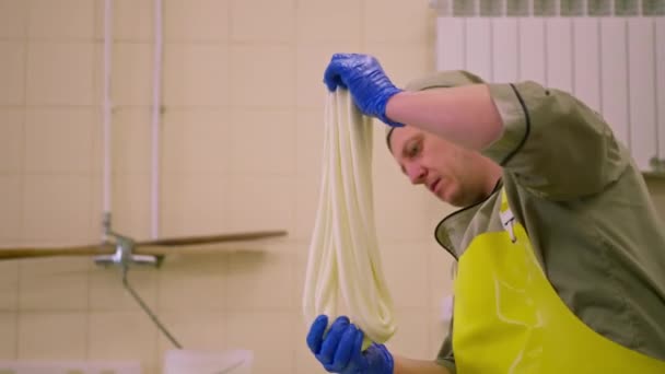 Production Dairy Cheeses Cheesemaker Sculpts Fresh Mozzarella His Hands Stretches — Stock Video
