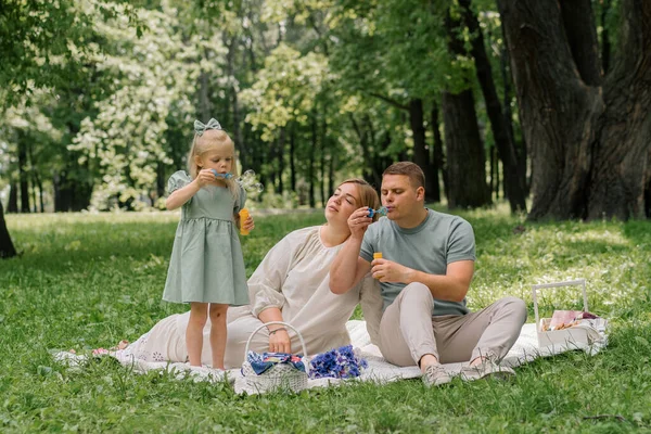 Happy Family Relaxing Outdoors Park Dad Daughter Blowing Soap Bubbles — Stock Photo, Image