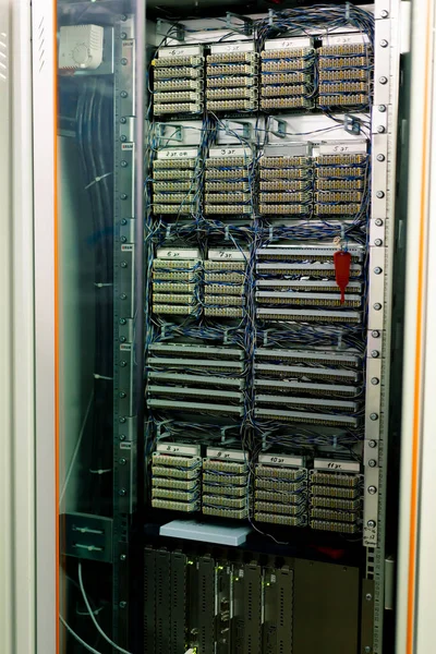 A rack-mounted computer server in a data center room in a hotel or technology enterprise digital communications internet abstract data concept