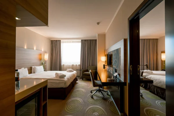 interior of a luxury hotel room after cleaning housekeeping bedroom rest room concept cleanliness and hospitality travel rest