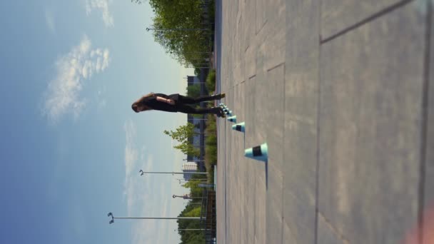 Sporty Girl Practicing Tricks Roller Skates Park City Background Enjoying — Stock Video
