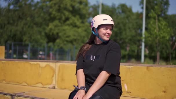 Young Girl Protective Helmet Sits Skate Park Waiting Her Exit — Stock Video