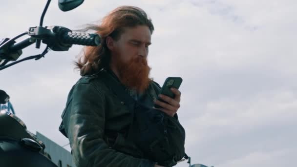 Portrait Brutal Pensive Red Haired Bearded Biker Sitting Black Motorcycle — Stock Video