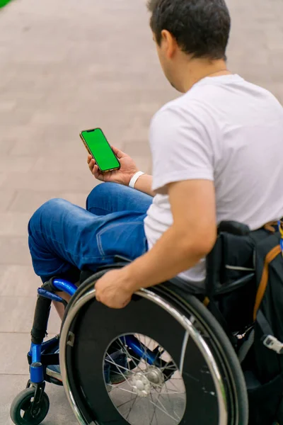 Inclusiveness Man Disabilities Wheelchair Holds Phone Open Green Screen City — Stock Photo, Image