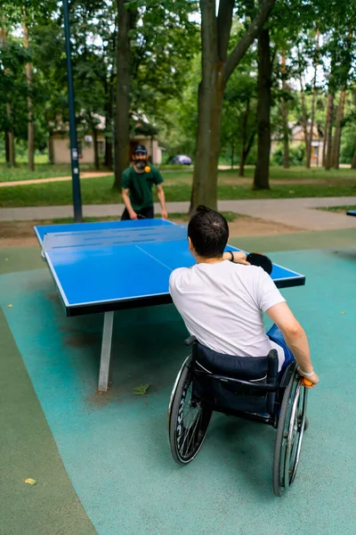 Inclusiveness Disabled Man Wheelchair Plays Ping Pong Old Man Gray — Stock Photo, Image