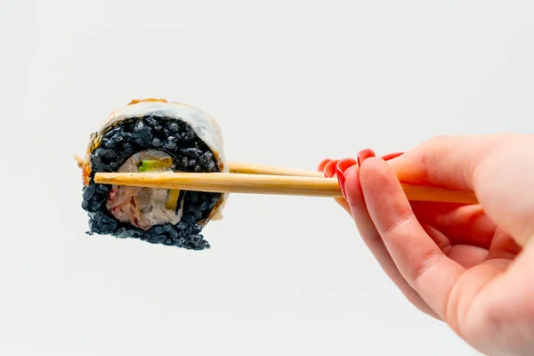 Close Sushi California Black Rice Eel Man Holds Chopsticks White — Stock Photo, Image