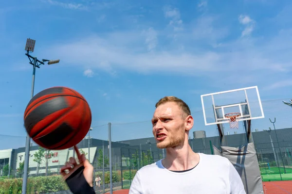 stock image Close-up of guy basketball player spinning a basketball on his finger showing his basketball freestyle skills