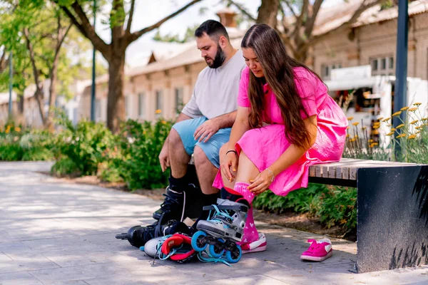 Young Couple Guy Girl Wear Rollerblades Sitting Bench Park While — Stock Photo, Image