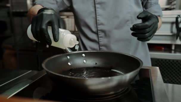Chef Professional Kitchen Restaurant Pouring Oil Pan Cooking Close — Stock Video