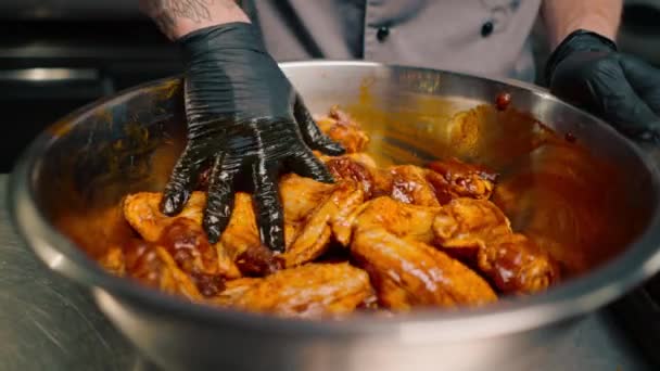 Professional Restaurant Kitchen Chef Stirs Chicken Wings Spices Bowl Asian — Stock Video