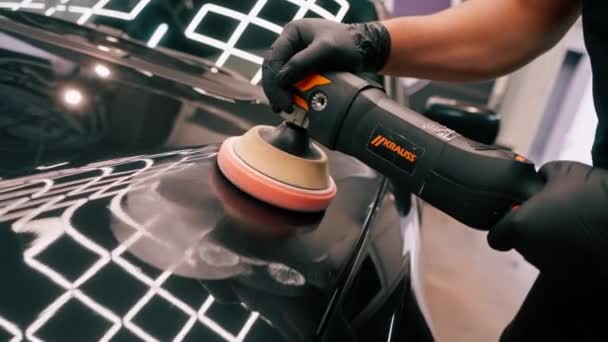 Close Car Wash Worker Using Polishing Machine Polish Hood Black — Stock Video