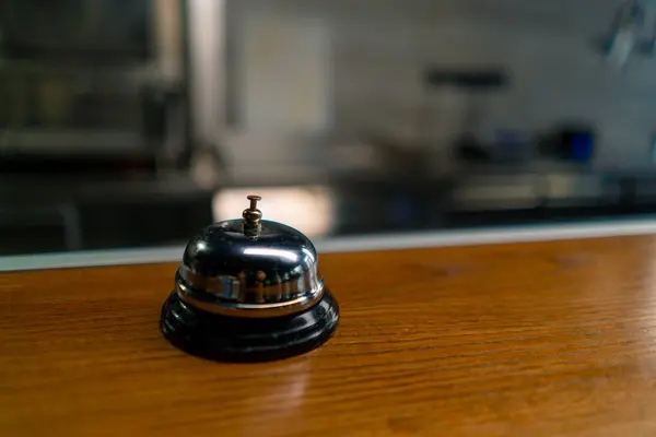 a call on the background of a professional kitchen for the cook which is pressed when the dish is ready notify the waiter