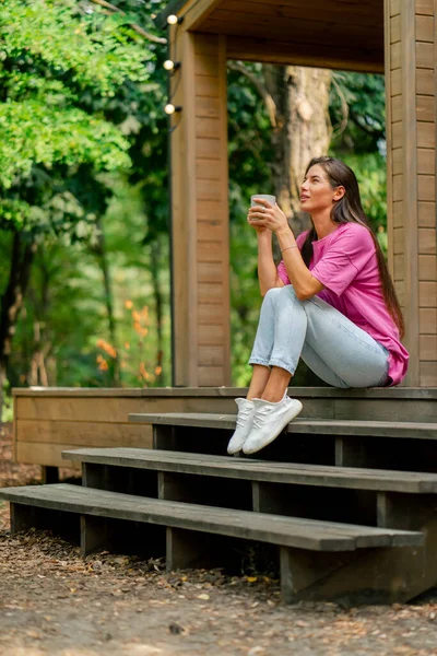 Thoughtful Girl Sits Cup Tea Terrace Her Wooden Cottage Woods — Stock Photo, Image