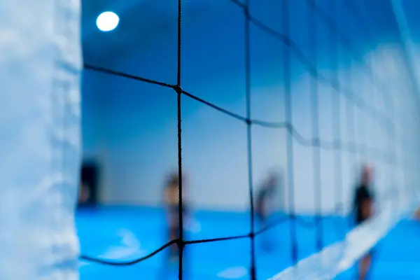 close-up sports equipment volleyball net on closed blue court competition matches details