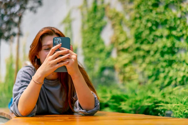Young Girl Lying Park Bench Phone Her Hands She Texting — Stock Photo, Image