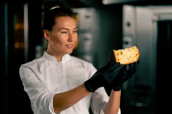 Portrait Smiling Female Baker Holding Piece Freshly Cut Easter Loaf — Stock Photo, Image