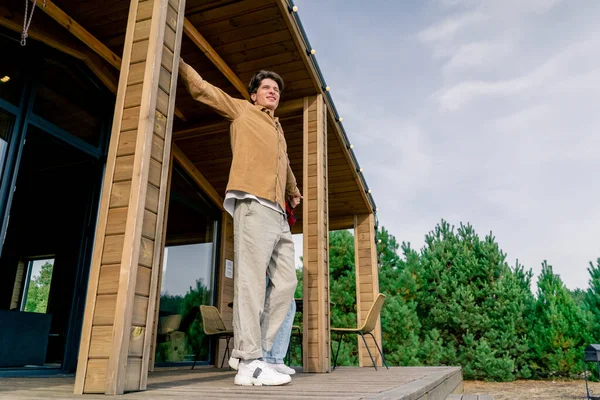 Young Guy Stretches Out Terrace Wooden House Early Morning Goes — Stock Photo, Image