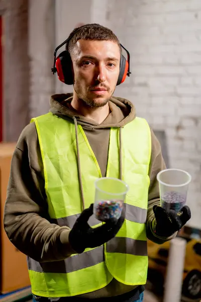 Portrait Man Uniform Headphones Holding Glasses Shredded Plastic Lids Recycling — Stock Photo, Image