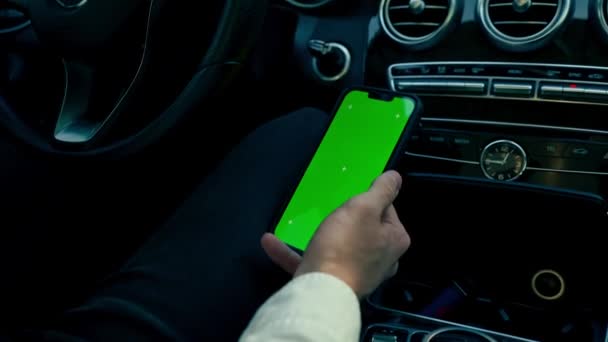Close Driver Wheel Luxury Car Holding Smartphone Hands Green Screen — Stock Video