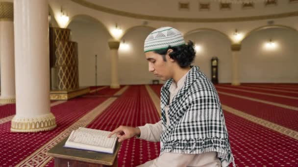 Islamic Prayer Concept Muslim Man Carefully Studies Holy Quran Prays — Stock Video