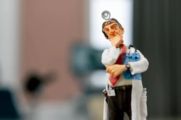 Close Shot Ceramic Figurine Doctor White Coat Frontal Reflector His — Stock Photo, Image