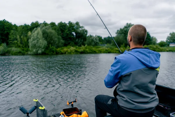 Fisherman Fishing Rod Spinning Professional Tools Sitting River Bank Rear — Stock Photo, Image