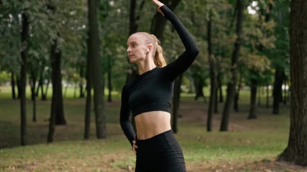 Close Girl Sportswear Bends Different Sides Stretch Her Back Muscles — Stock Video