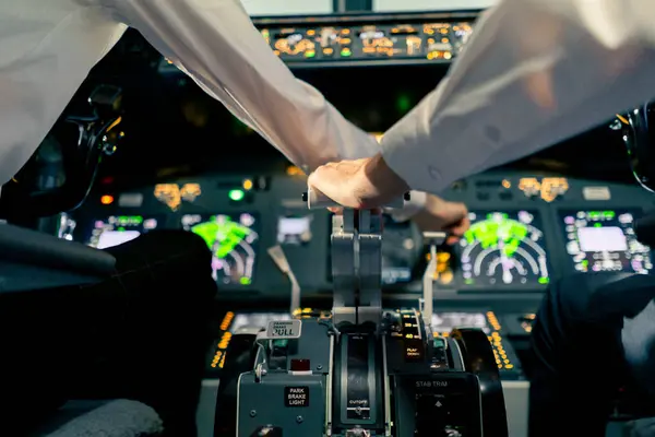 Airplane pilot controls throttle during flight or takeoff Cockpit view close-up air traffic control