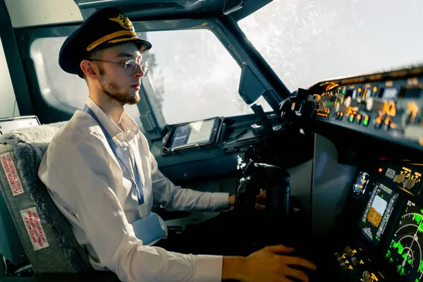young pilots in the cockpit of the plane control air transport during long distance flight simulator