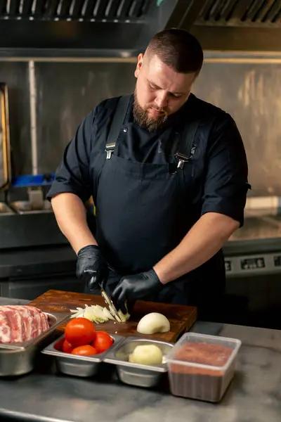 Professional Kitchen Chef Black Uniform Chops Onions Board — Stock Photo, Image