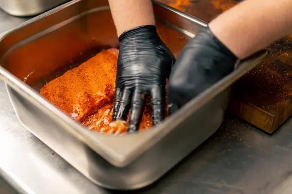 Close Professional Kitchen Chef Black Gloves Marinates Ribs Iron Bowl — Stock Photo, Image