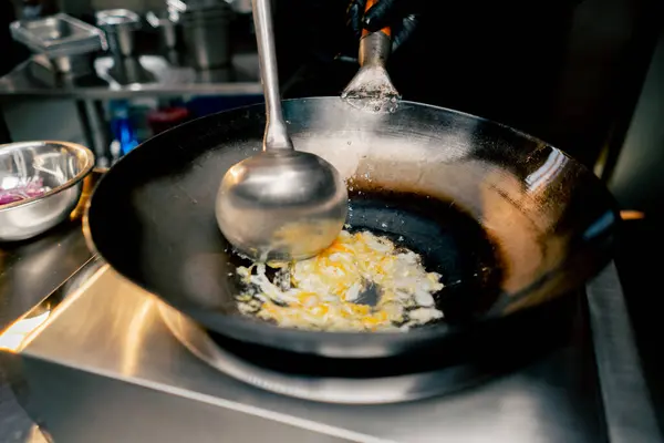 Close Plan Frying Egg Large Spoon Hot Frying Pan Future — Stock Photo, Image