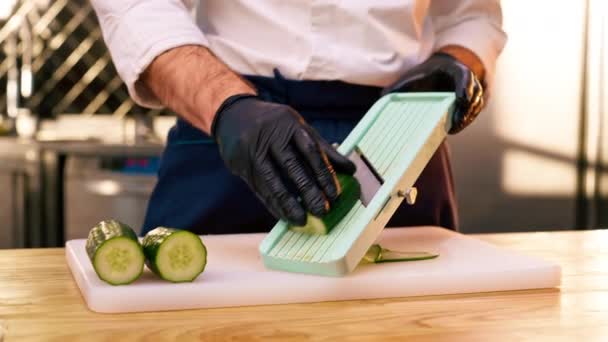 Close Hands Black Gloves Slicing Cucumbers Grater White Board — Stock Video