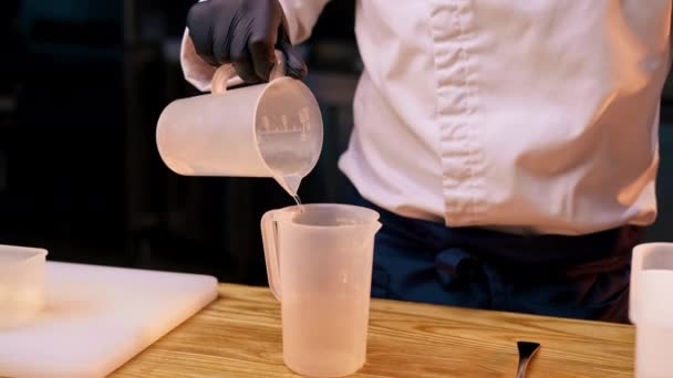 Close Professional Kitchen Chef Pours Liquid One Container Another — Vídeos de Stock