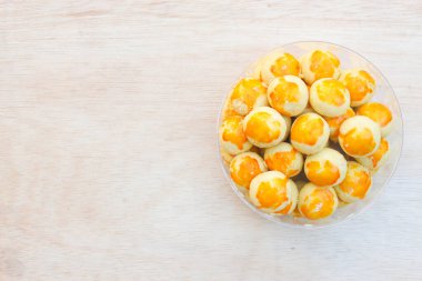 Nastar, a cake whose main ingredient is wheat flour. Served during Eid al-Fitr. Nastar has several variants, such as Putri Snow (sprinkled with white sugar) and Kastengel (cheese topping). clipart