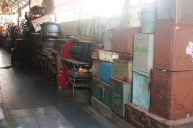 A row of secondhand goods and antiques line the hallway clipart