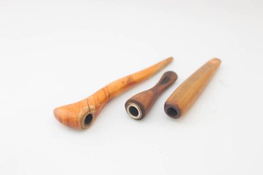 Wooden smoking pipe on white background