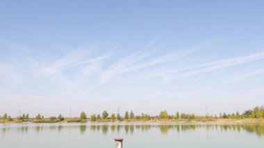 Water depth measuring stick in a lake