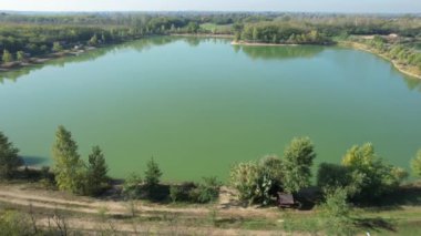 A whole big fishing lake from above in the summer