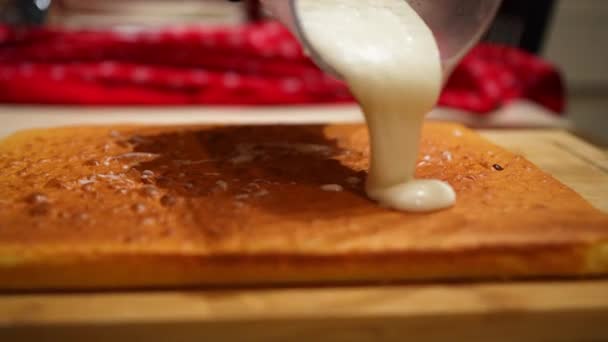 Pouring Icing Freshly Baked Cake — Stockvideo