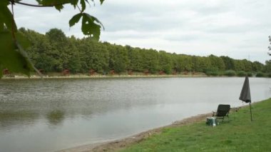 Calm fishing lake and angling equipment left unattended